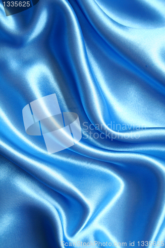 Image of Smooth elegant blue silk as background 