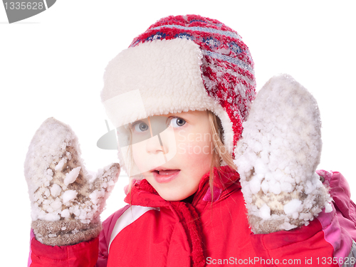 Image of girl wearing mittens with snow 