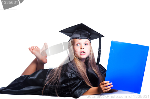 Image of cute girl in black academic capand gown