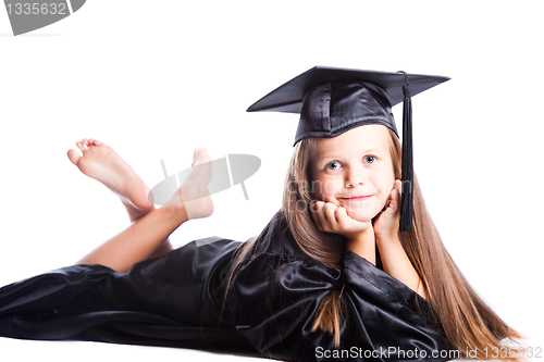 Image of cute girl in black academic capand gown