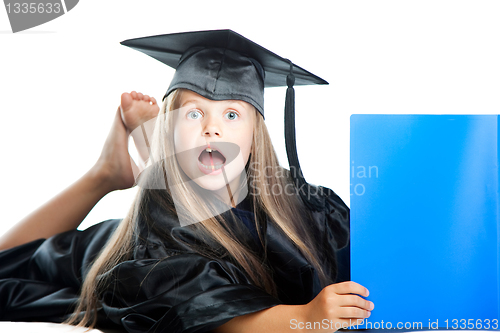 Image of cute girl in black academic capand gown