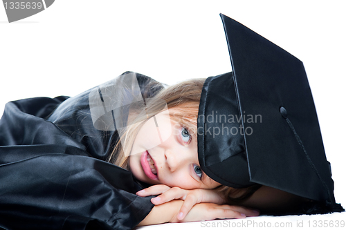 Image of cute girl in black academic capand gown