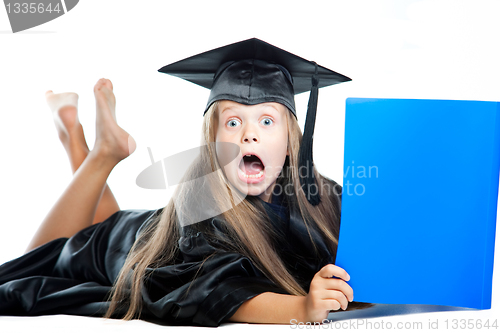 Image of girl in black academic capand gown
