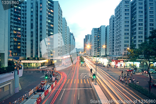 Image of traffic in downtown at sunset moment