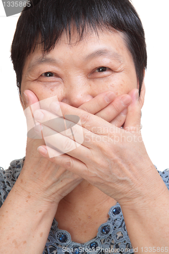 Image of old woman covering her mouth