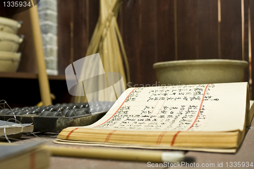 Image of abacus and book on the table in a chinese old shop 