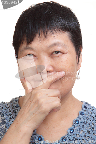Image of old asian woman thinking