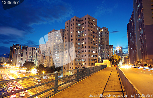 Image of modern urban city at night with freeway traffic