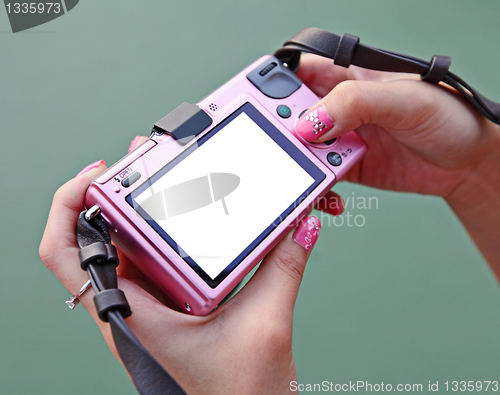 Image of digital camera in a hand