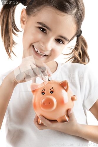 Image of Little girl with a piggy-bank