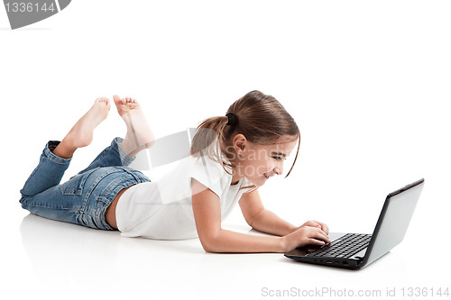 Image of Little student girl with a laptop