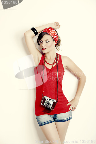 Image of Pin-up girl with a camera
