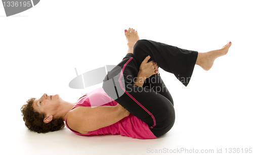 Image of excited middle age senior woman athlete tennis player