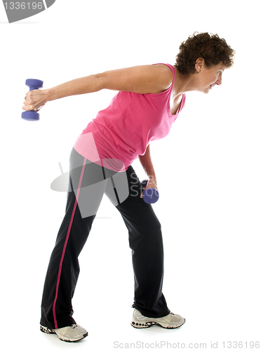 Image of  middle age senior woman athlete exercise dumbbells 