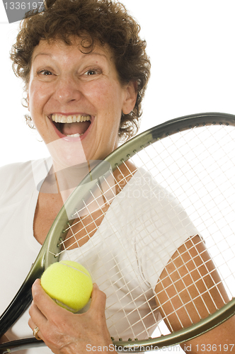 Image of excited middle age senior woman athlete tennis player