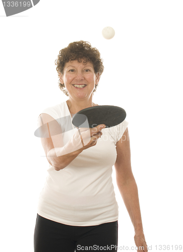 Image of middle age senior woman playing ping pong 