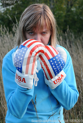 Image of Angry Woman Wearing Boxing Gloves