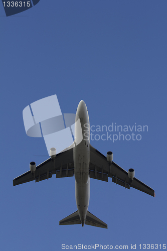 Image of A commercial airplane flying over
