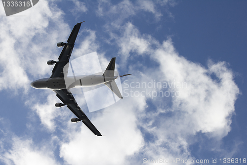 Image of A large airplane tilting right