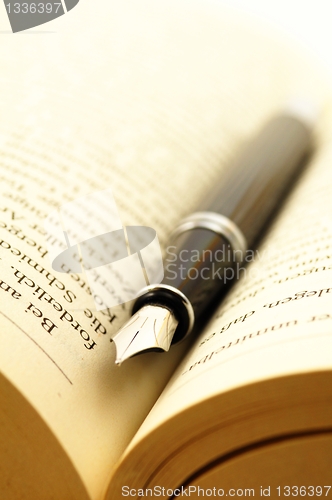 Image of book and pen