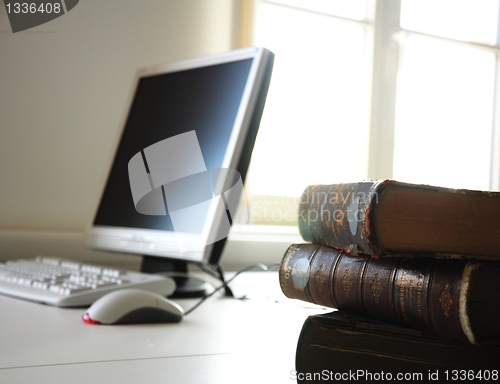 Image of books and computer