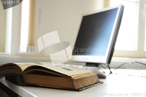 Image of books and computer