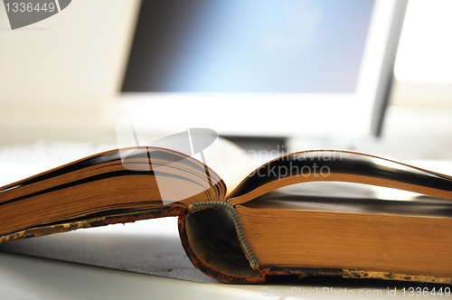 Image of books and computer