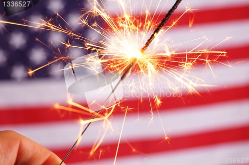 Image of sparkler and usa flag