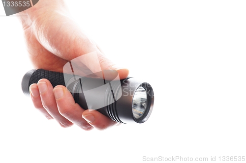 Image of hand and flashlight