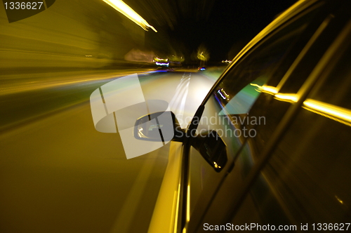 Image of night drive with car in motion 