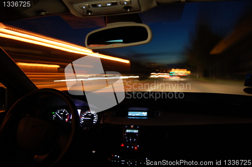 Image of night drive with car in motion 