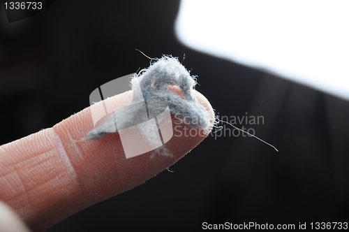 Image of dust and finger