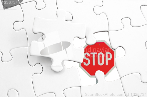 Image of puzzle and stop sign