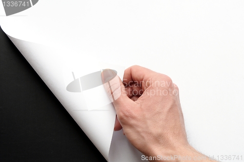 Image of paper and hand