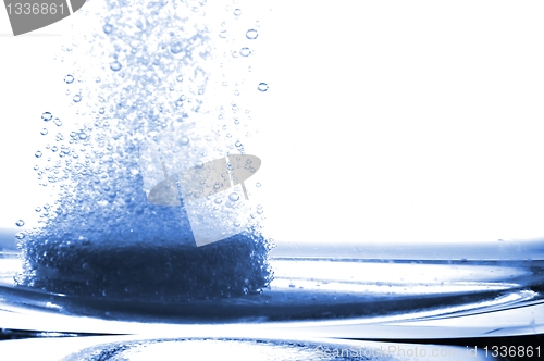 Image of tablet in glass water