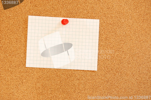 Image of blank sheet of paper on bulletin board