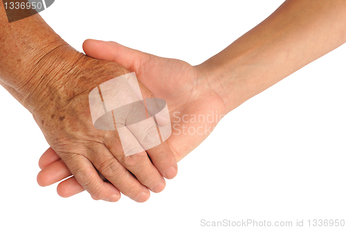 Image of Hands of young and senior women - helping hand concept - clipping path included