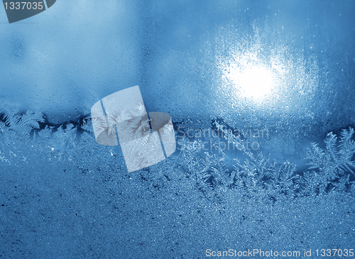 Image of frosty natural pattern and sun