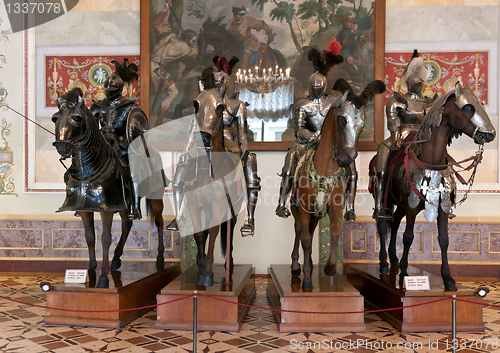 Image of The exhibition in the Hermitage Museum, four horsemen in armor.