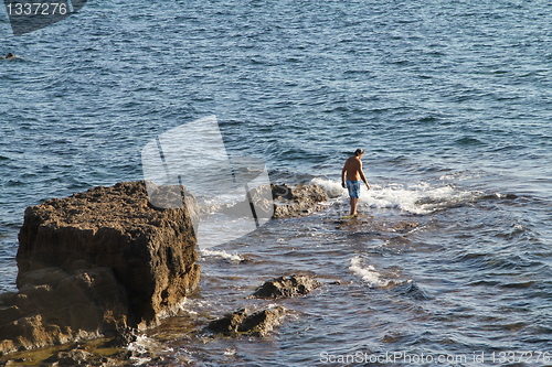 Image of Man in water swimming