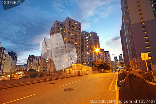 Image of modern urban city at night with freeway traffic