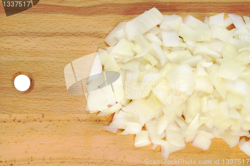 Image of Chopped onions on a wooden board