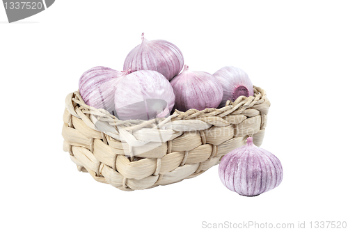 Image of Several garlic in a wicker basket