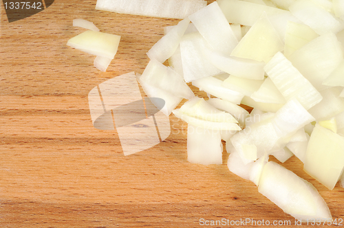 Image of Chopped onions on a wooden board