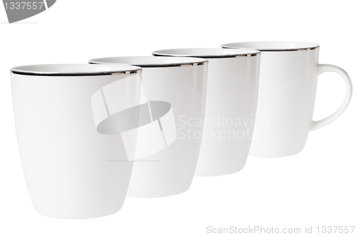 Image of Four empty cup standing in line