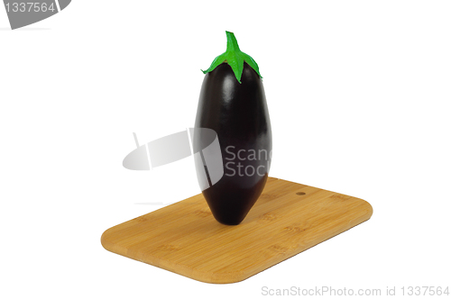 Image of Eggplant on wooden board isolated on white.