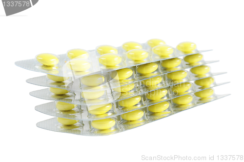 Image of Several packs of yellow pills