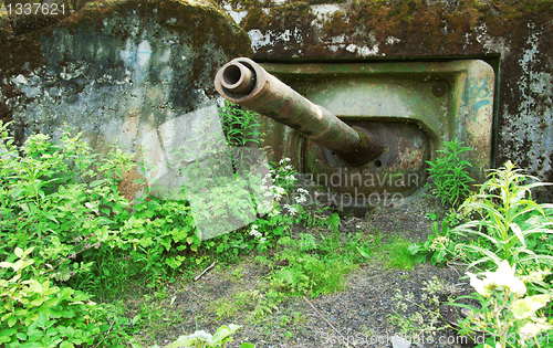 Image of Old abandoned military pillbox with a tank cannon.