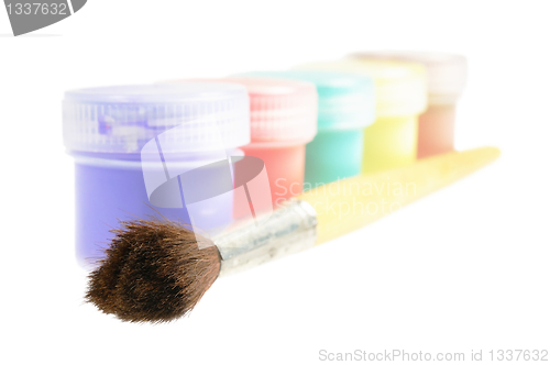 Image of Five cans  of paint and brush