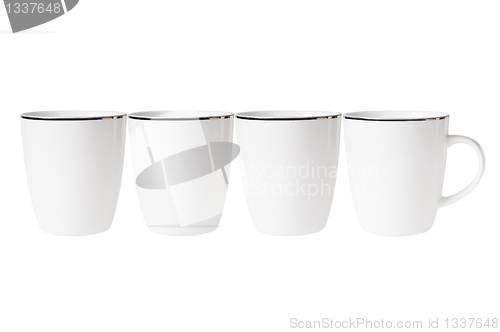 Image of Four empty cup standing in line